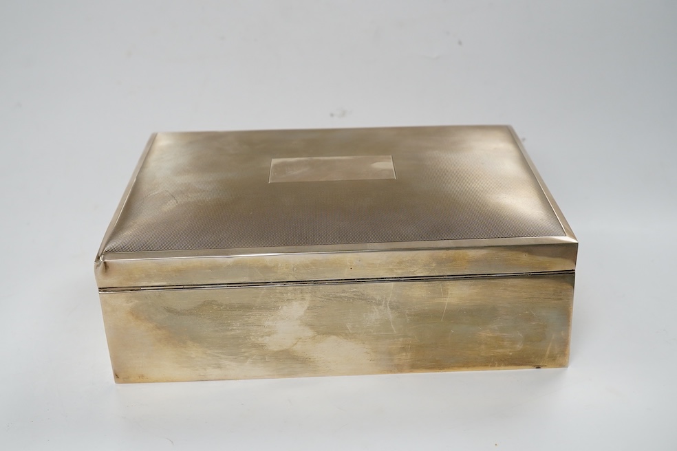 A 1970's silver mounted cigar/cigarette box, Birmingham, 1973, 22.9cm. Condition - poor